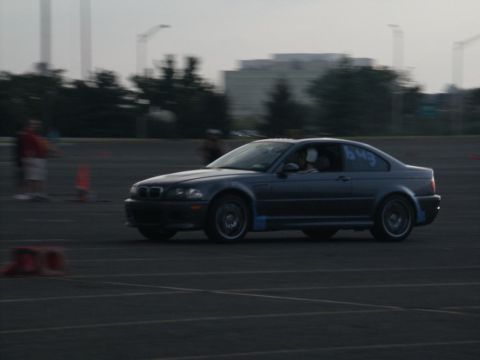 2001 Mercury Grand Marquis - A dark coupe is seen on a track, possibly during a timed event.