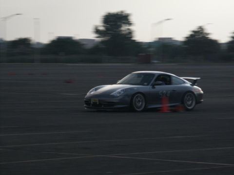 2001 Mercury Grand Marquis - A silver Porsche 911 navigates a track, marked with the number 324 on its side.