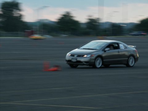2001 Mercury Grand Marquis - A gray coupe navigates a cone course on a track, with the number 202 visible on its door.
