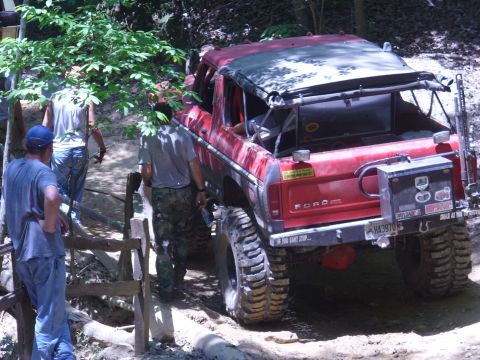 1996 Ford Bronco - This red Ford Bronco is equipped for off-road adventures with its modified suspension and large tires.