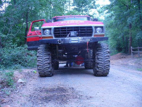 1996 Ford Bronco - This heavily modified Ford truck features an aggressive front end with a winch and oversized tires.