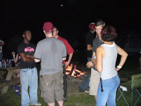 1991 Ford Probe - Friends gather around a bonfire, enjoying an evening outdoors.