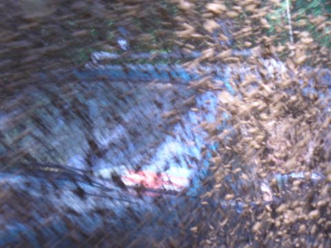 1996 Ford Bronco - A vehicle is covered in mud and debris, suggesting it has been driven off-road.