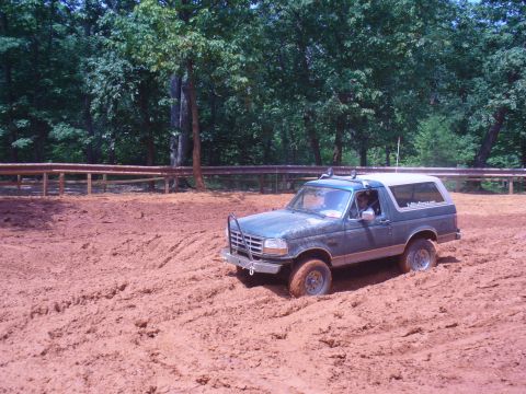 1996 Ford Bronco - This 1996 Ford Bronco is navigating a challenging muddy terrain.