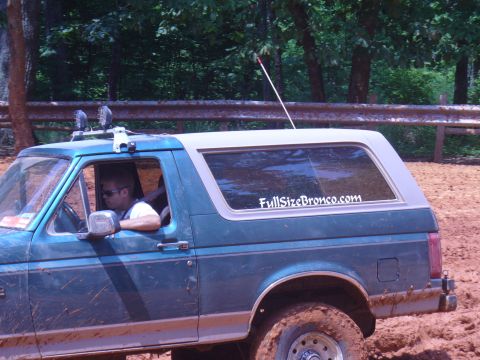 1996 Ford Bronco - This 1996 Ford Bronco, seen on a muddy trail, features a "FullSizeBronco.com" sticker on its rear window.