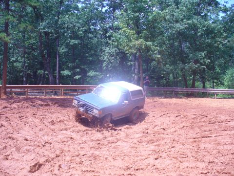 1996 Ford Bronco - A 1996 Ford Bronco navigates a muddy off-road course.