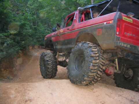1979 Ford Bronco - This modified Ford Bronco is navigating a challenging off-road trail.