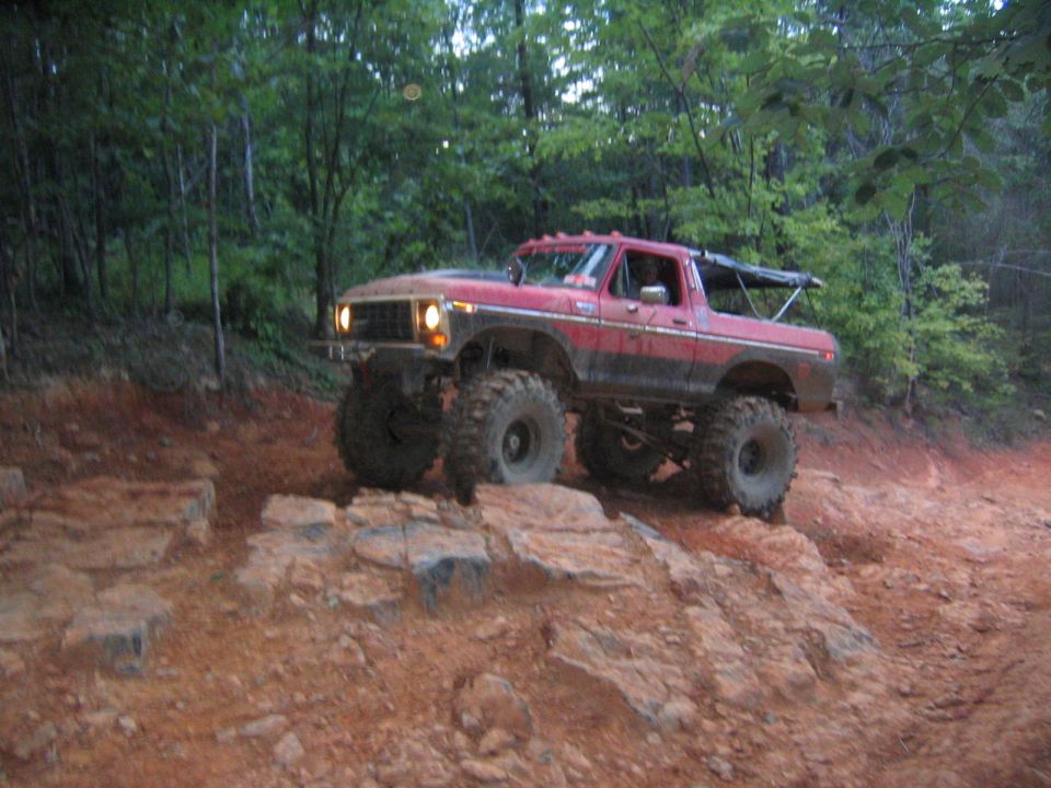 Red 1979 Ford Bronco on rocky trail