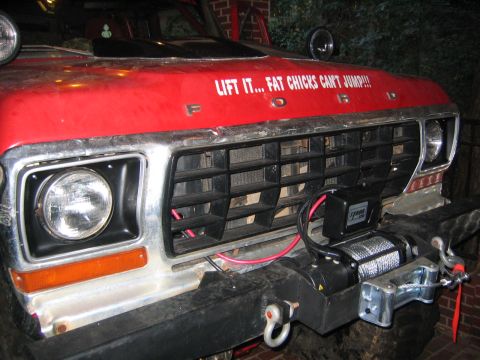 1979 Ford Bronco - Front view of a 1979 Ford Bronco, a winch and custom hood text.
