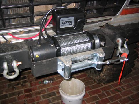 1979 Ford Bronco - A winch is attached to the front bumper of a vehicle.