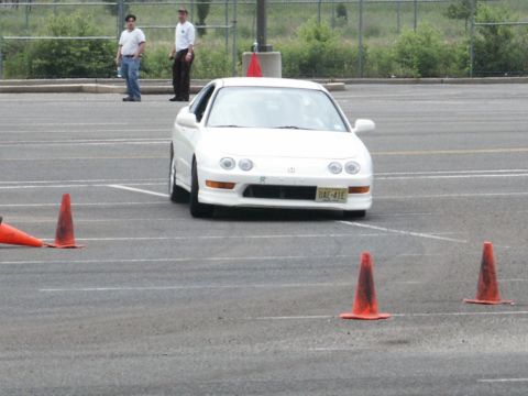 2001 Mercury Grand Marquis - A white Acura Integra navigates an autocross course with orange cones marking the path.