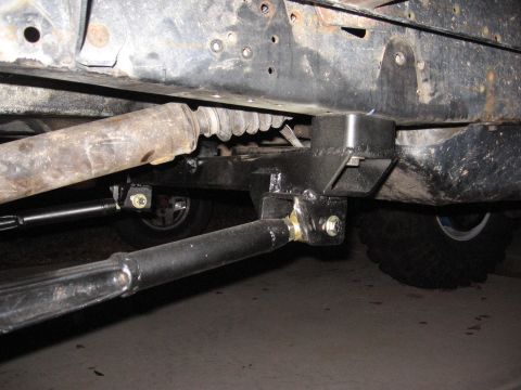 1990 Ford Bronco - Aftermarket suspension components are visible under a vehicle's frame.