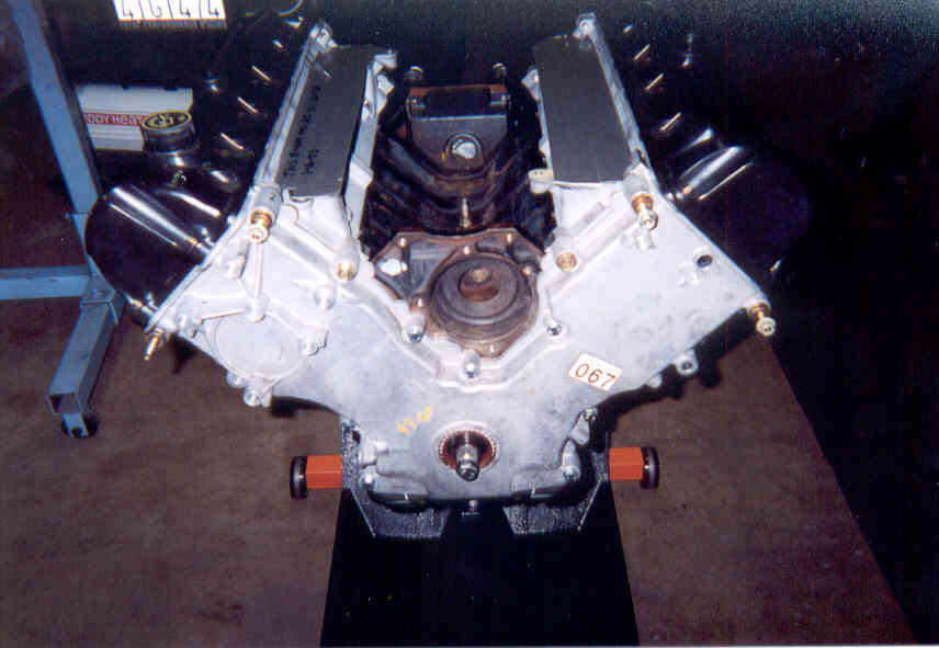 Aluminum V8 engine front view showing timing cover, crank snout and cam gear