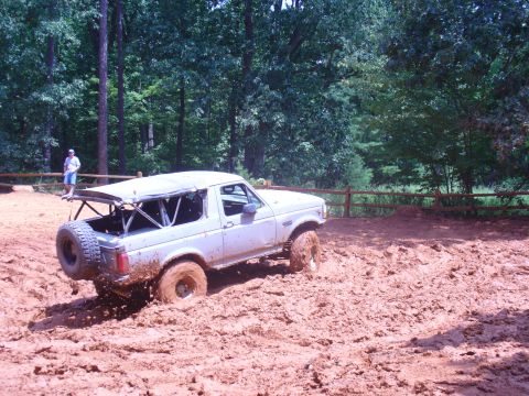 1996 Ford Bronco - A 1996 Ford Bronco is stuck deep in mud during an off-road excursion.