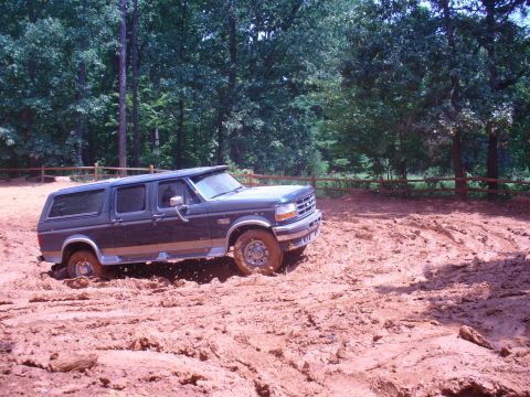 1996 Ford Bronco - This 1995 Ford Bronco navigates a muddy off-road trail.