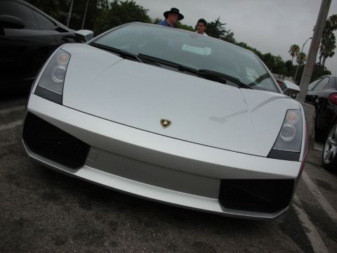 1998 Ford Crown Victoria - Head-on view of a silver Lamborghini Gallardo showing its angular nose, headlights and the bull crest.