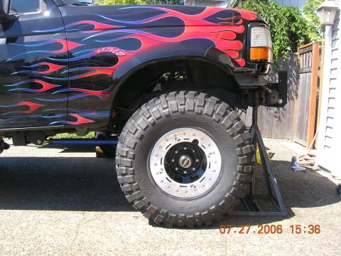 1996 Ford Bronco - This 1996 Ford Bronco features custom flame decals and is supported by a jack stand.
