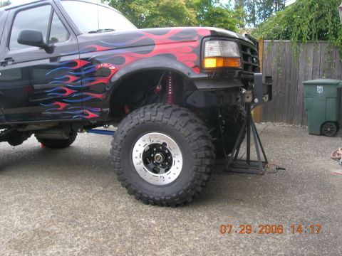 1996 Ford Bronco - This 1996 Ford Bronco features custom flame graphics and a lifted suspension.