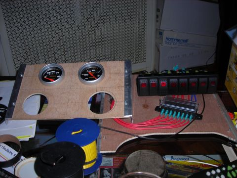 1995 Ford Bronco - A custom dashboard panel features two gauges and a row of six switches, likely for aftermarket accessories.