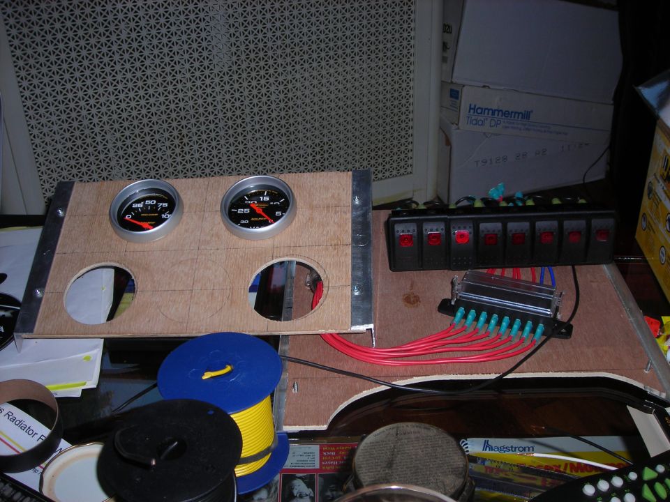 Custom dashboard panel with two gauges and a row of six switches
