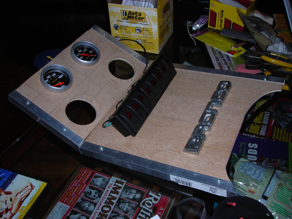 Custom dashboard panel with two gauges, a switch bank, and a chrome 'BRONCO' emblem