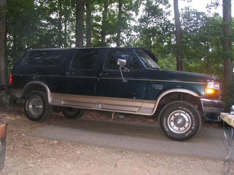 1995 Ford C-350 (Centurion Conversions) - This 1995 Ford C-350 Centurion Conversions SUV is seen in a wooded area.
