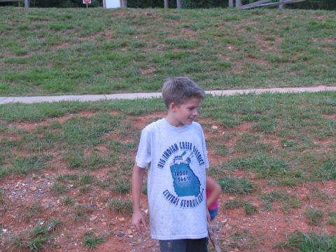 1995 Ford C-350 (Centurion Conversions) - Boy wearing a t-shirt with troop and district information printed on the front.