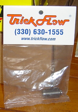 1986 Ford Bronco - A Trick Flow branded part is shown in its packaging, with contact information visible.