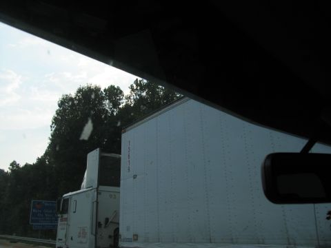 1995 Ford C-350 (Centurion Conversions) - A white tractor-trailer is seen from the side, with the number 13619 visible on the trailer.