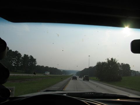 1995 Ford C-350 (Centurion Conversions) - Driving on a highway with trees and other vehicles visible.