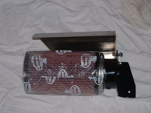 1998 Ford Crown Victoria - K&N cone air filter still in its plastic wrap mounted on a stainless heat-shield bracket, shown on a white cloth.