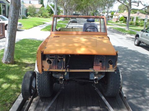 1977 Ford Bronco - This 1977 Ford Bronco is on a trailer, showing its front end with missing grille.