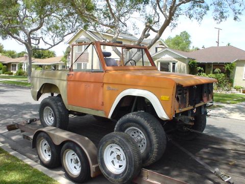 1977 Ford Bronco - This classic Ford Bronco is being transported on a trailer, showing signs of restoration or repair.