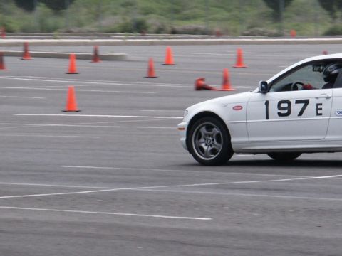 2001 Mercury Grand Marquis - A white sedan with racing number 197E navigates a course marked by orange cones.