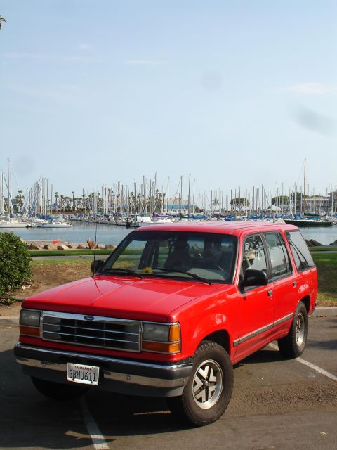 1992 Ford Explorer - 1992 Ford Explorer parked in front of a marina full of sailboats.