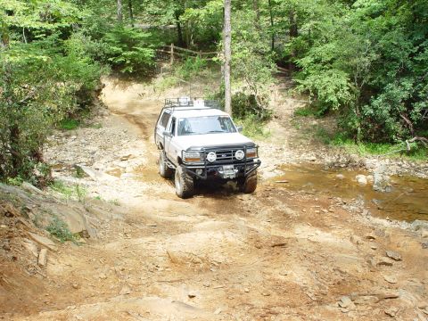 1996 Ford Bronco - This 1996 Ford Bronco navigates a challenging off-road course with a custom bumper and roof rack.
