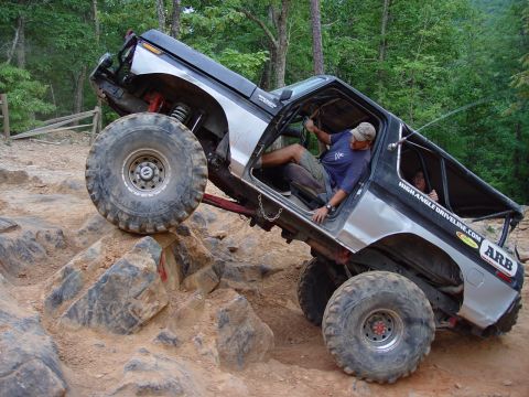 1996 Ford Bronco - Off-road Bronco navigating a challenging rock crawl course.