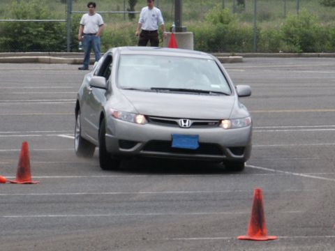2001 Mercury Grand Marquis - A silver Honda Civic navigates a course marked by orange cones.