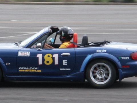 2001 Mercury Grand Marquis - A blue convertible race car with the number 181 is seen on the track, Hoosier tires and various racing decals.