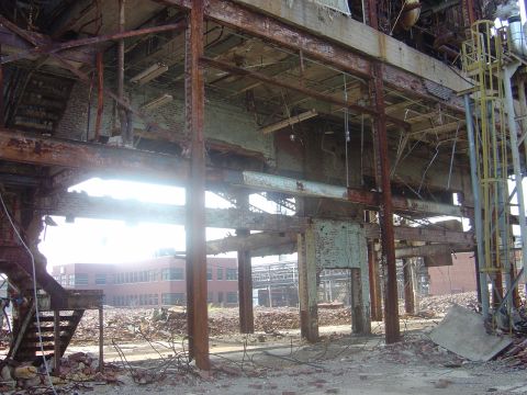 1987 Suzuki Samurai - The remains of a large industrial structure, showing extensive damage and decay.