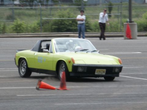 2001 Mercury Grand Marquis - A lime green convertible sports car navigates a course marked by traffic cones.