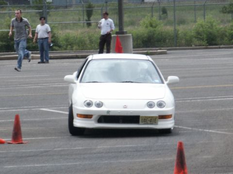 2001 Mercury Grand Marquis - White Acura Integra coupe on a course with cones and people in the background.