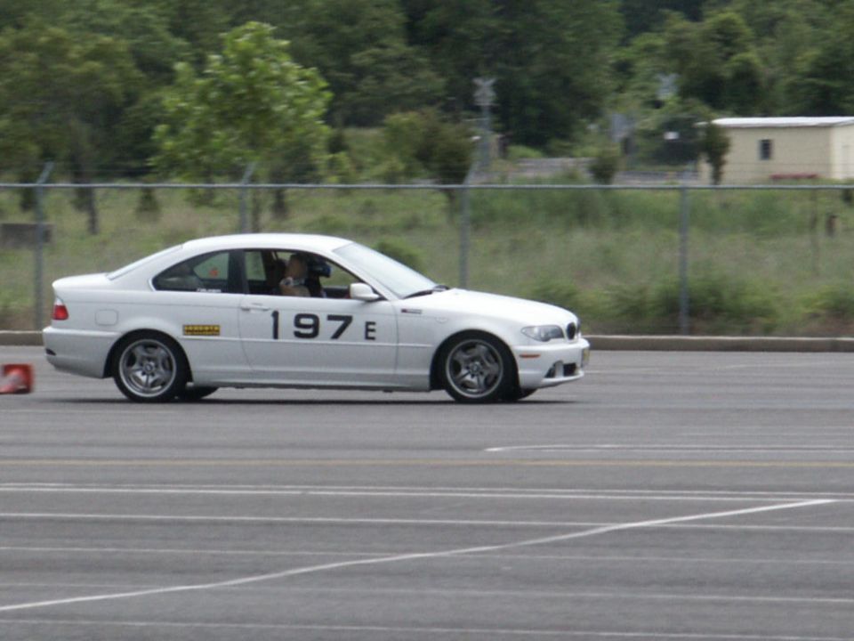 White BMW E46 coupe on a track, number 197 E on the door
