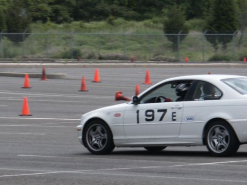 2001 Mercury Grand Marquis - A white coupe with racing numbers navigates a course marked by orange cones.