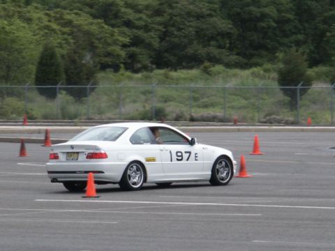 2001 Mercury Grand Marquis - White coupe with racing numbers on the door navigates a course marked by orange cones.