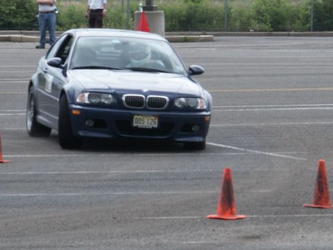 2001 Mercury Grand Marquis - A blue BMW coupe navigates a course marked by orange cones.