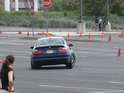 2001 Mercury Grand Marquis - A dark blue sedan navigates a course marked by orange traffic cones.