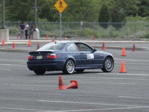 2001 Mercury Grand Marquis - A blue coupe, marked with racing number 61A, maneuvers through a cone course during an event.