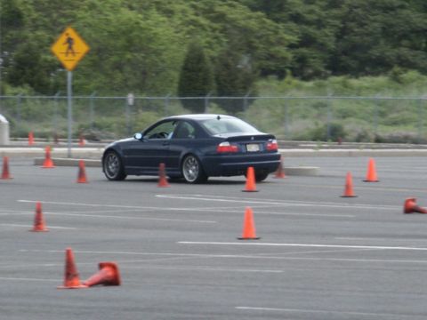2001 Mercury Grand Marquis - A dark blue coupe navigates an autocross course marked by orange cones.