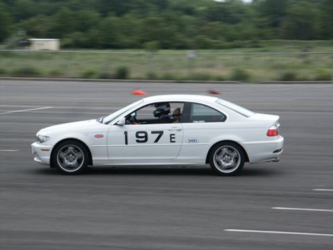 2001 Mercury Grand Marquis - A white coupe with racing number 197E on its door is seen on a track.